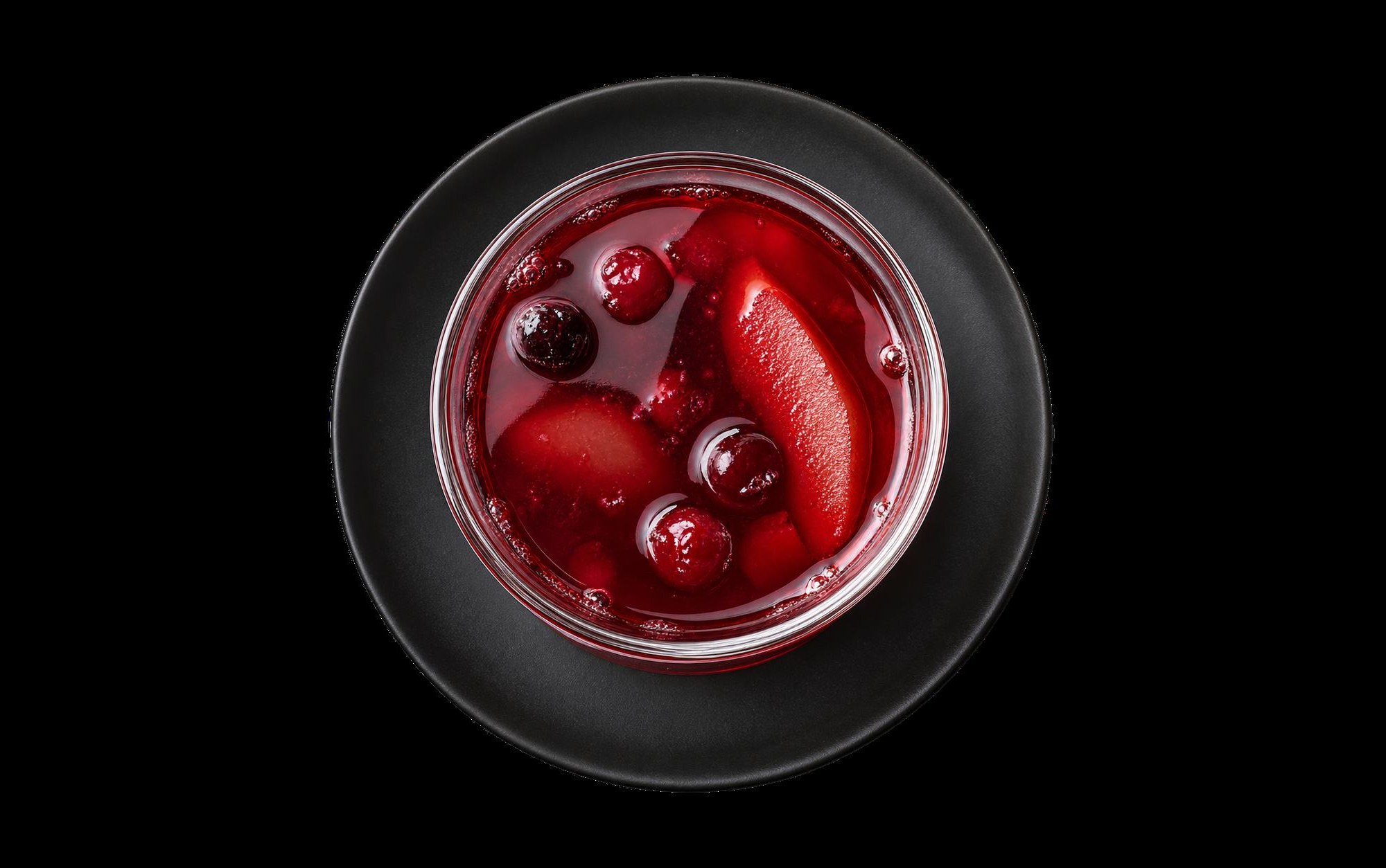 Homemade compote with berries and pears in a glass jar